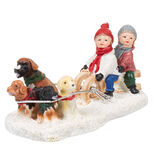 Personnage village de Noël enfants avec traineau et chiens