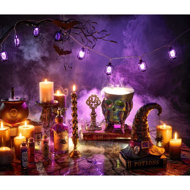 Seau &agrave; bonbons Halloween t&ecirc;te de squelette violet iridescent 17x14xH13cm