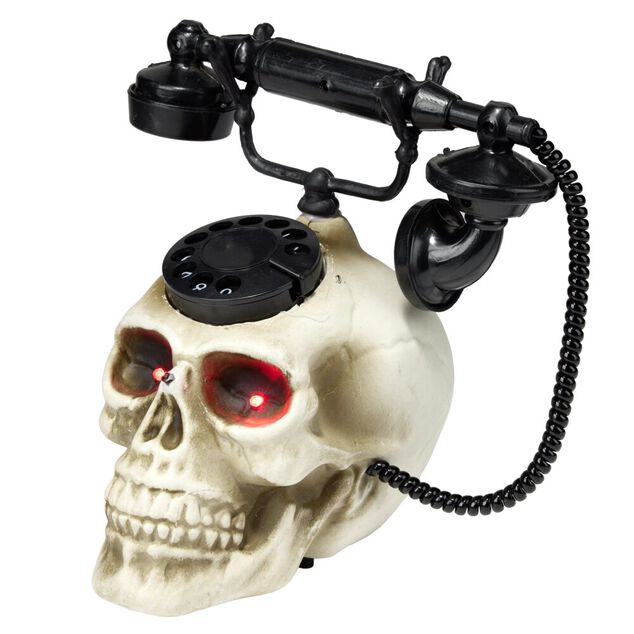 T&eacute;l&eacute;phone t&ecirc;te de mort Halloween LED d&eacute;tecteur mouvement son et lumi&egrave;re 19x22xH25cm