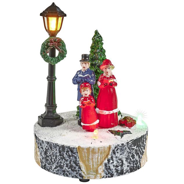 Scène village de Noël avec lanterne lumineuse