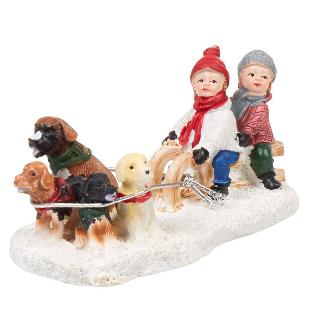 Personnage village de No&euml;l enfants avec traineau et chiens