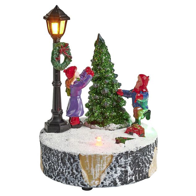 Scène village de Noël avec lanterne lumineuse