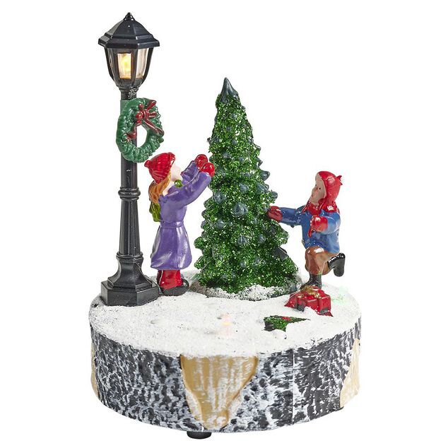 Scène village de Noël avec lanterne lumineuse