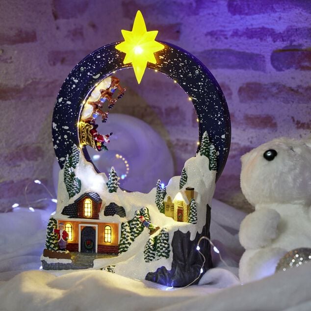 Village anim&eacute; et lumineux avec maisons et traineau P&egrave;re No&euml;l 19x11xH29cm