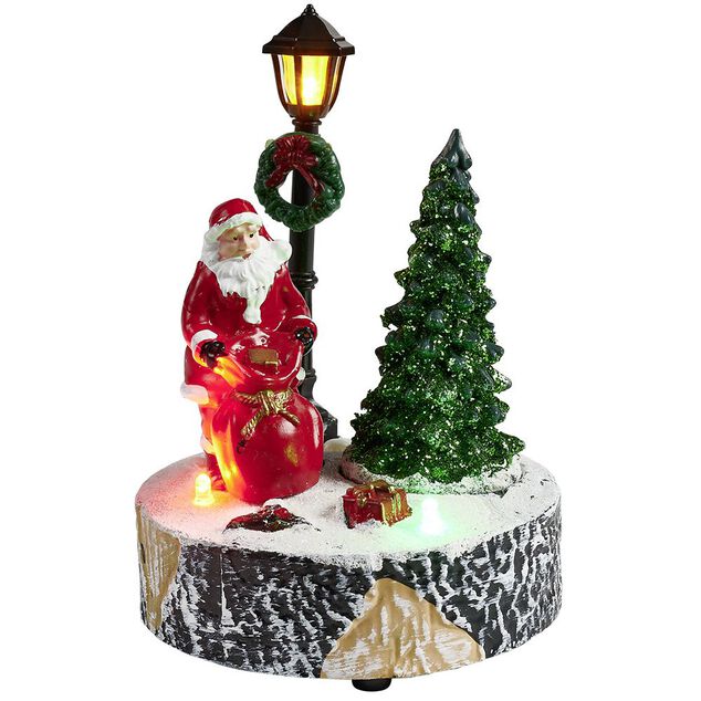 Scène village de Noël avec lanterne lumineuse