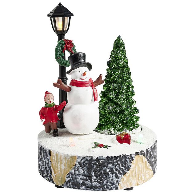 Scène village de Noël avec lanterne lumineuse