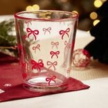 Verre bas transparent motifs noeuds roses Ø8,8xH10cm