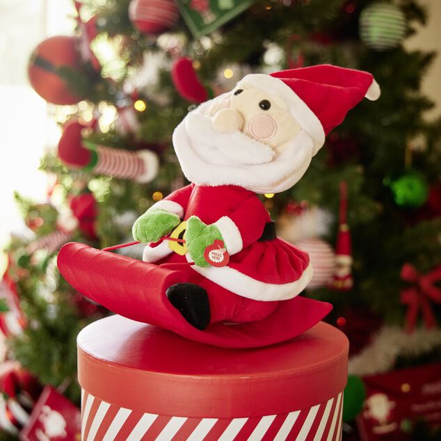 Père-Noël sur luge sonore et animé 15x20xH25cm