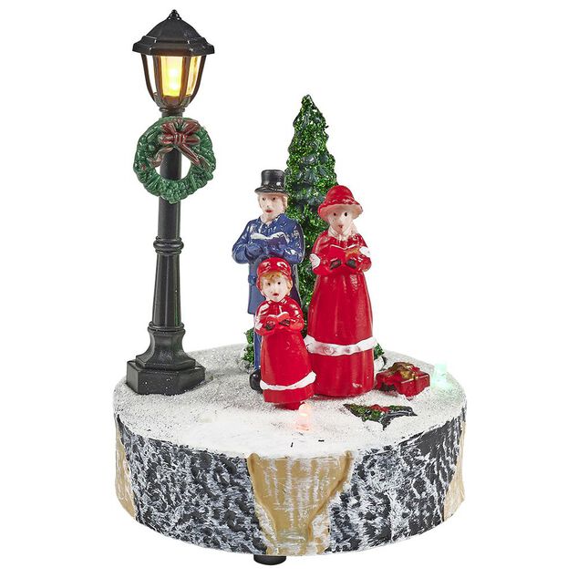 Scène village de Noël avec lanterne lumineuse