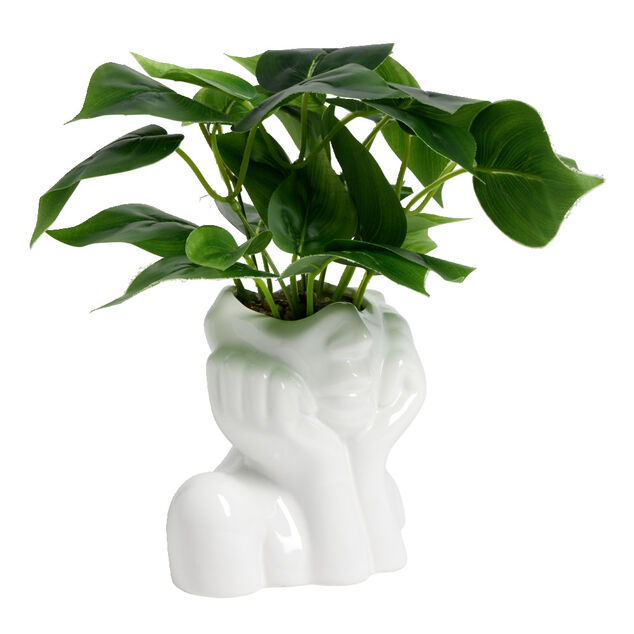Pot en c&eacute;ramique visage blanc avec plante verte artificielle 14x9xH25cm